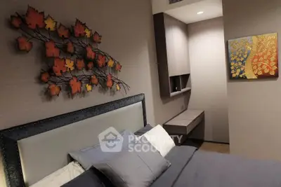 Modern bedroom with stylish wall art and cozy bedding