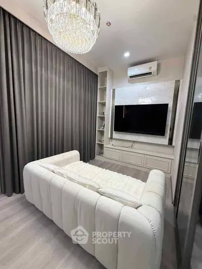 Luxurious bedroom with elegant chandelier and modern decor