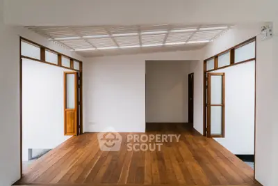 Spacious interior with wooden flooring and open layout, perfect for modern living.