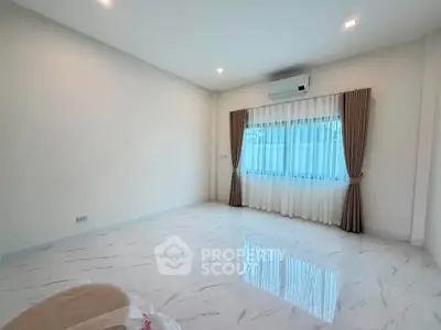 Spacious empty room with marble flooring and large window, perfect for customization.