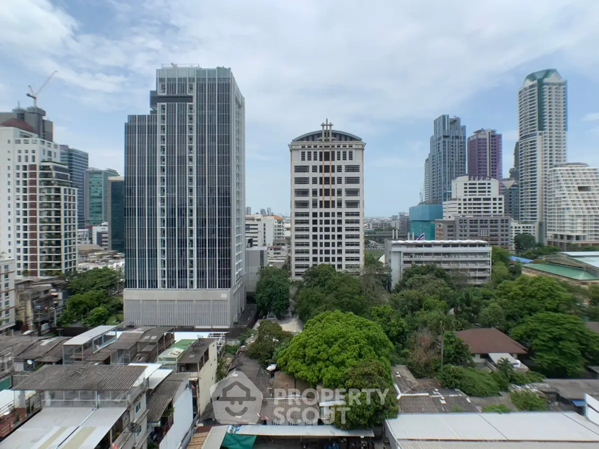Stunning cityscape view showcasing modern high-rise buildings and lush greenery in an urban setting.