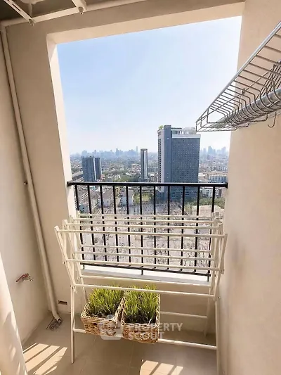 Stunning balcony view with cityscape, perfect for relaxation and enjoying urban living.