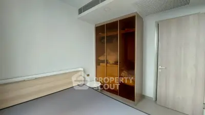 Modern bedroom with built-in wardrobe and minimalist design