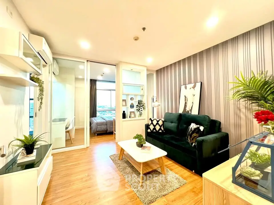 Modern living room with stylish decor and open view to bedroom