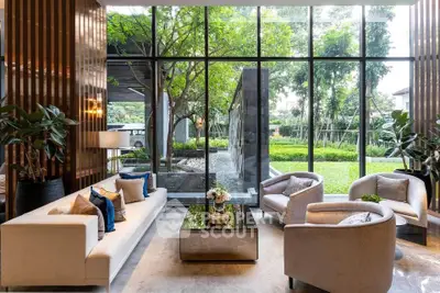 Luxurious living room with garden view and elegant furniture