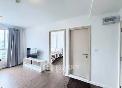 Modern apartment interior with bright living room and cozy bedroom