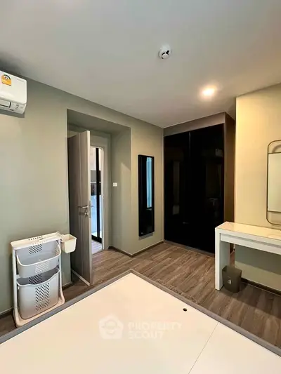 Modern bedroom with sleek design and ample storage space