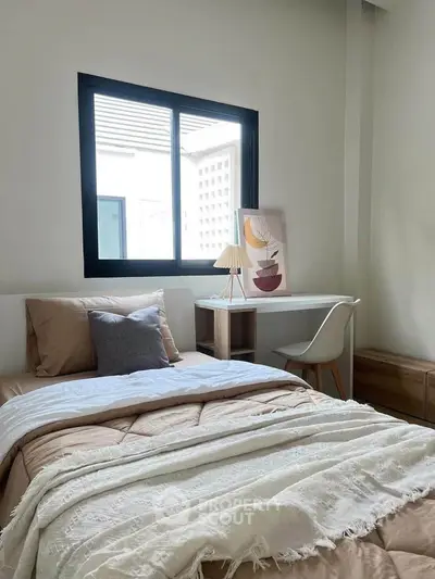 Cozy bedroom with modern decor and natural light