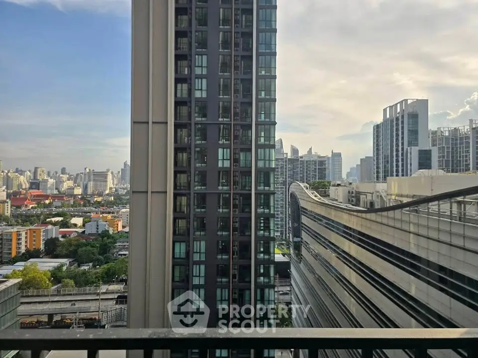 Stunning urban skyline view from a high-rise balcony, showcasing modern architecture and cityscape.