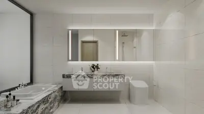 Luxurious modern bathroom with marble accents and large mirror