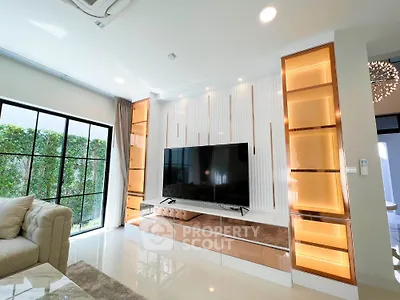 Luxurious living room with modern TV setup and elegant lighting