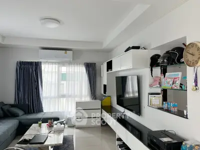 Modern living room with sleek furniture and entertainment center