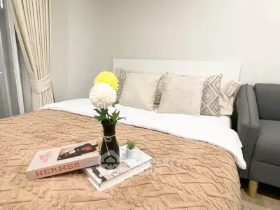 Cozy bedroom with stylish decor and plush bedding, perfect for relaxation.