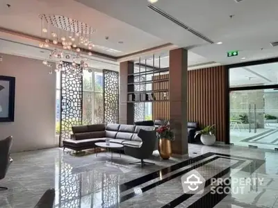 Luxurious modern lobby with elegant seating and stunning chandelier