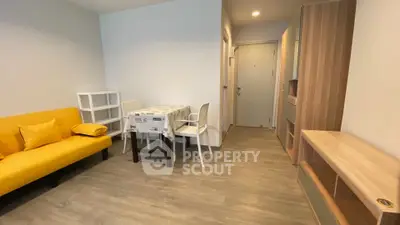 Modern living room with yellow sofa and dining area in stylish apartment