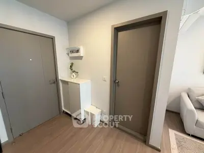 Modern apartment entrance with sleek design and neutral tones
