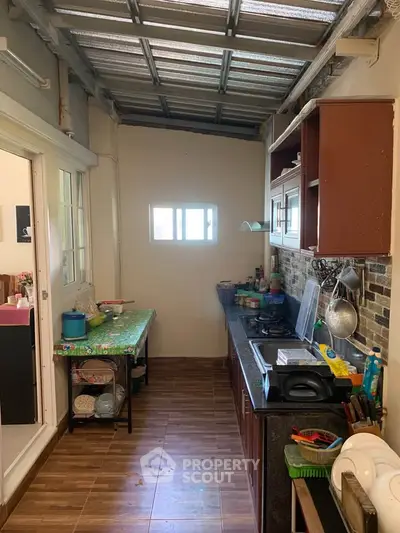 Compact kitchen with closed layout and modern appliances