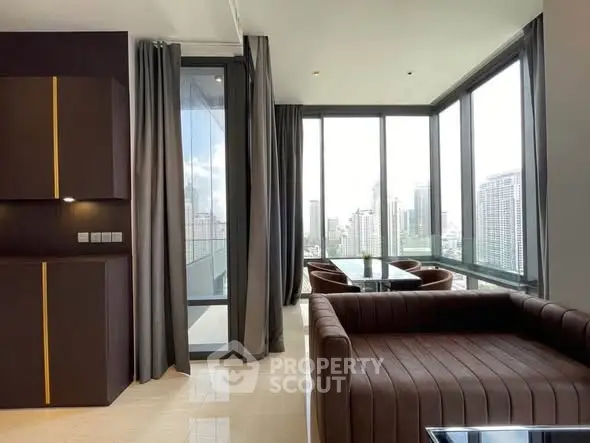 Luxurious modern living room with panoramic city views and elegant furnishings.