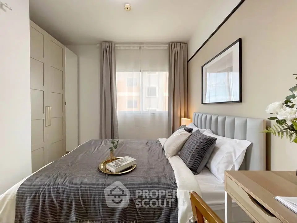 Modern bedroom with stylish decor, cozy bed, and ample natural light.