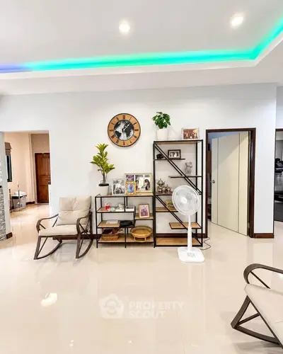 Spacious living room with modern decor and elegant shelving unit
