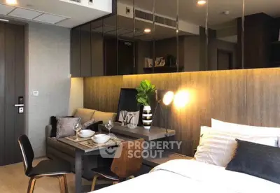 Modern studio apartment with stylish decor and cozy dining area