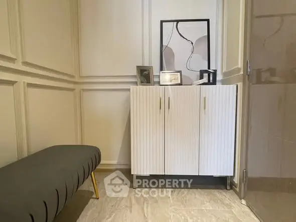 Stylish interior corner with modern cabinet and art decor