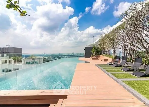 Luxurious rooftop pool with stunning city views and modern lounge area.