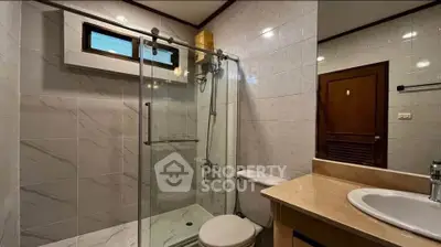 Modern bathroom with glass shower and elegant fixtures