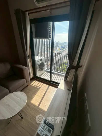 Modern living room with balcony view and air conditioning in urban apartment