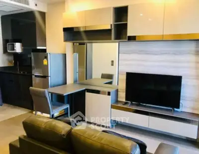 Modern living room with sleek furniture and integrated kitchen area, perfect for urban living.