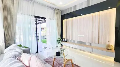 Elegant living room with modern decor and garden view