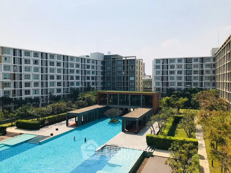 Luxurious apartment complex with stunning pool and lush gardens