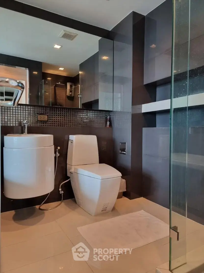Modern bathroom with sleek design and glass shower enclosure