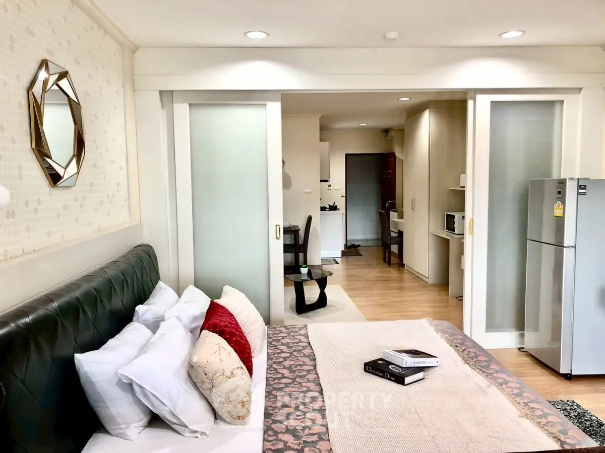 Modern open-plan living space with stylish decor and sliding doors