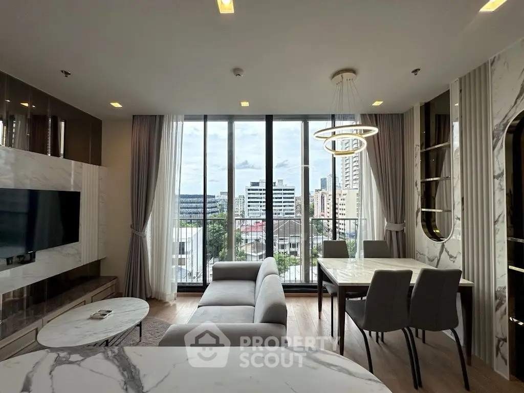 Luxurious modern living room with stunning city view and elegant marble accents