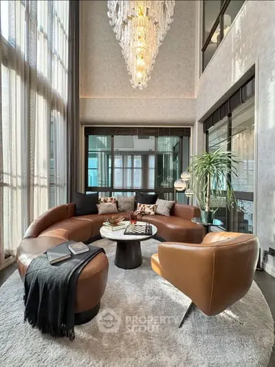 Luxurious living room with elegant chandelier and modern furniture