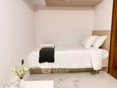 Cozy minimalist bedroom with single bed and elegant decor
