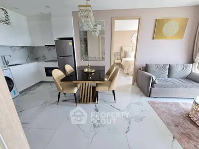 Modern open-plan living room with elegant dining area and stylish kitchen