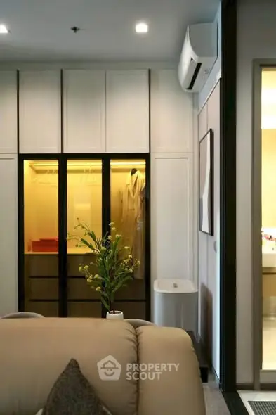 Modern living room with built-in wardrobe and stylish decor