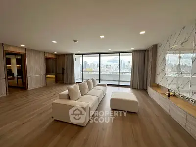 Luxurious living room with stunning city view and elegant marble accents