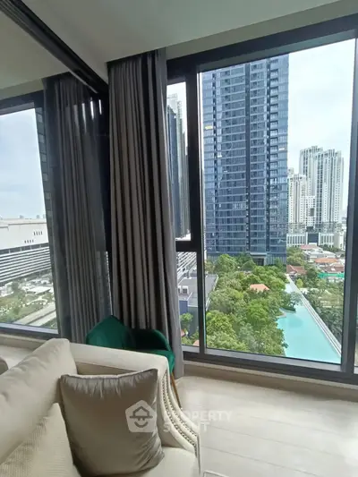 Luxurious high-rise apartment with stunning cityscape and pool view from the living room.