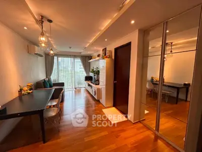 Modern living room with wooden flooring and stylish lighting