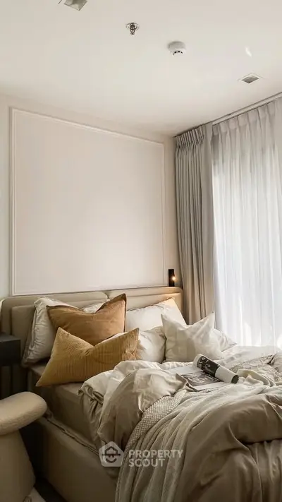 Cozy bedroom with elegant decor and natural light
