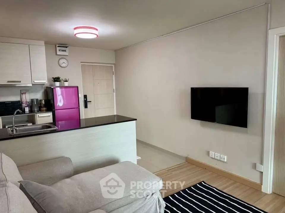 Modern living room with open kitchen and sleek design