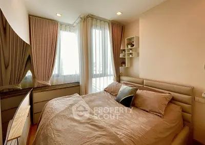 Cozy bedroom with elegant decor and natural light, featuring a plush bed and stylish curtains.