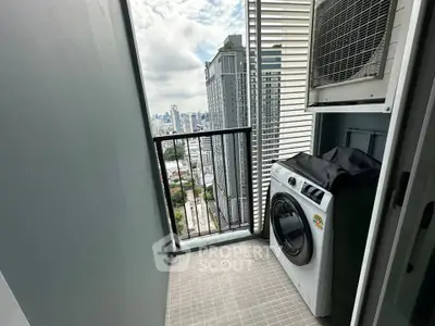 High-rise balcony with washing machine and city view, perfect for urban living.