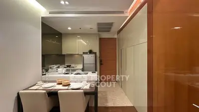 Modern kitchen with sleek design and dining area in luxury apartment