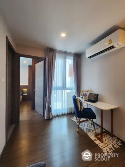 Modern study room with sleek wooden flooring and air conditioning