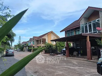 Charming suburban street with modern houses and lush greenery, perfect for family living.