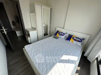 Modern bedroom with sleek furniture and natural light, featuring a comfortable bed and stylish wardrobe.